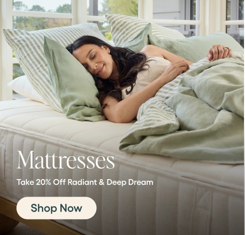 Woman sleeping on a mattress with promotional text for mattresses and a discount offer.