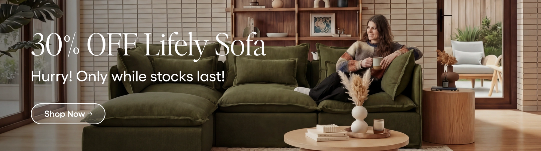 Promotional banner for a green sofa with a discount offer in a living room setting.