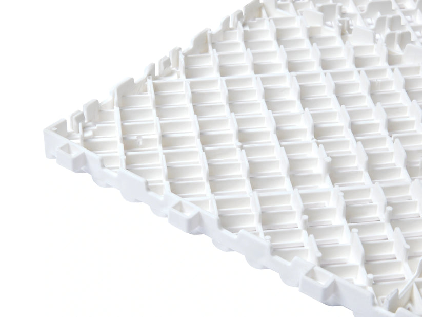 Underside of the White Cocoon Bed Airflow Pad showing raised ventilation channels
