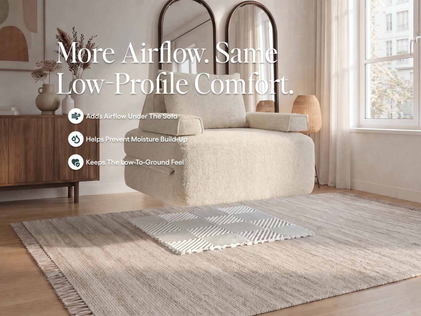 Compact cream Cushie sofa bed over a white Airflow Pad. Adds airflow, helps prevent moisture build-up and keeps a low profile.